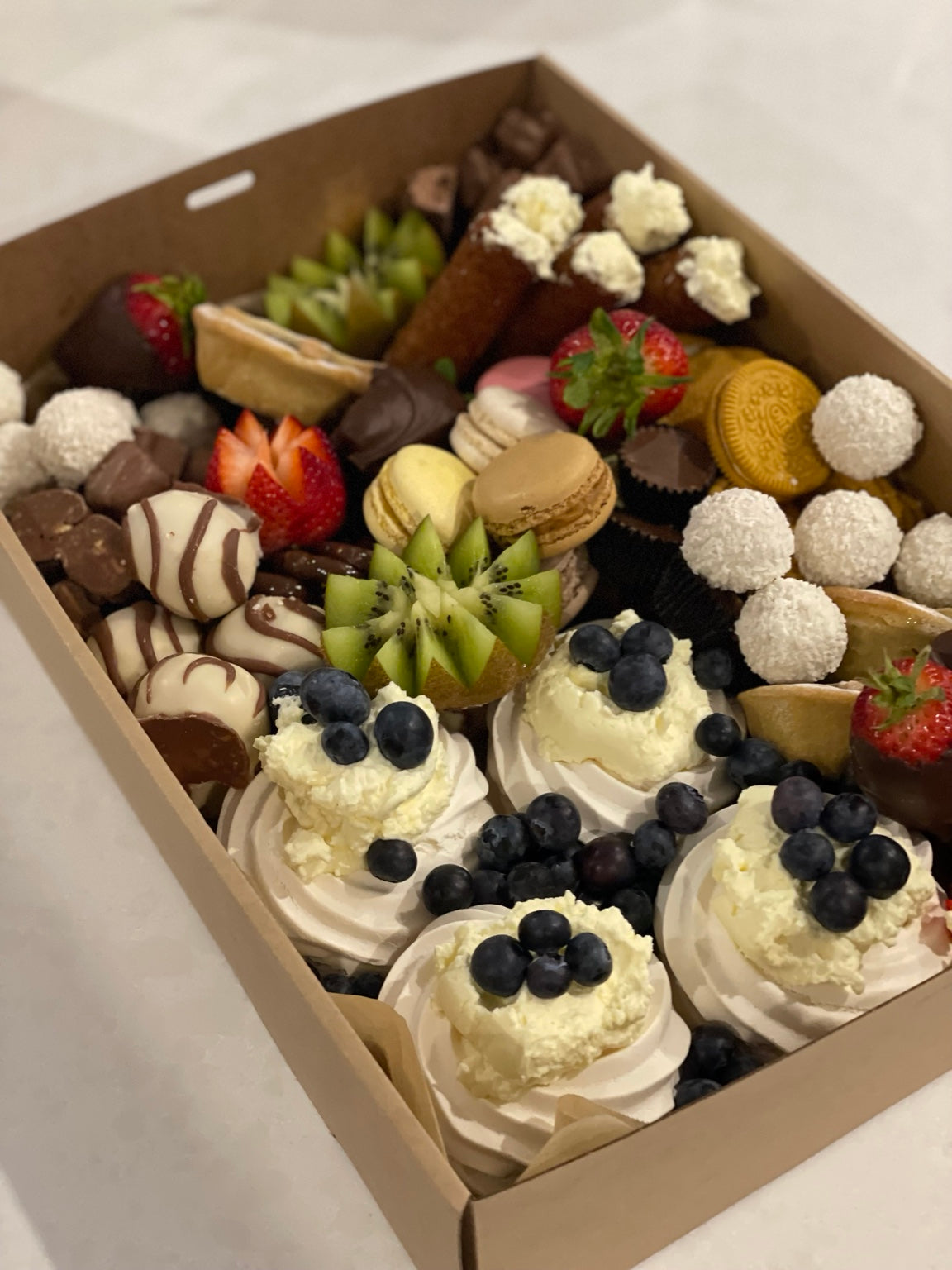 Dessert box with mini pavlovas and fruit