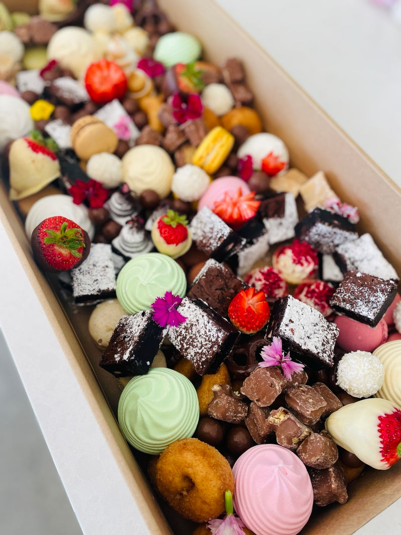 Dessert box with brownies, macarons and sweet treats